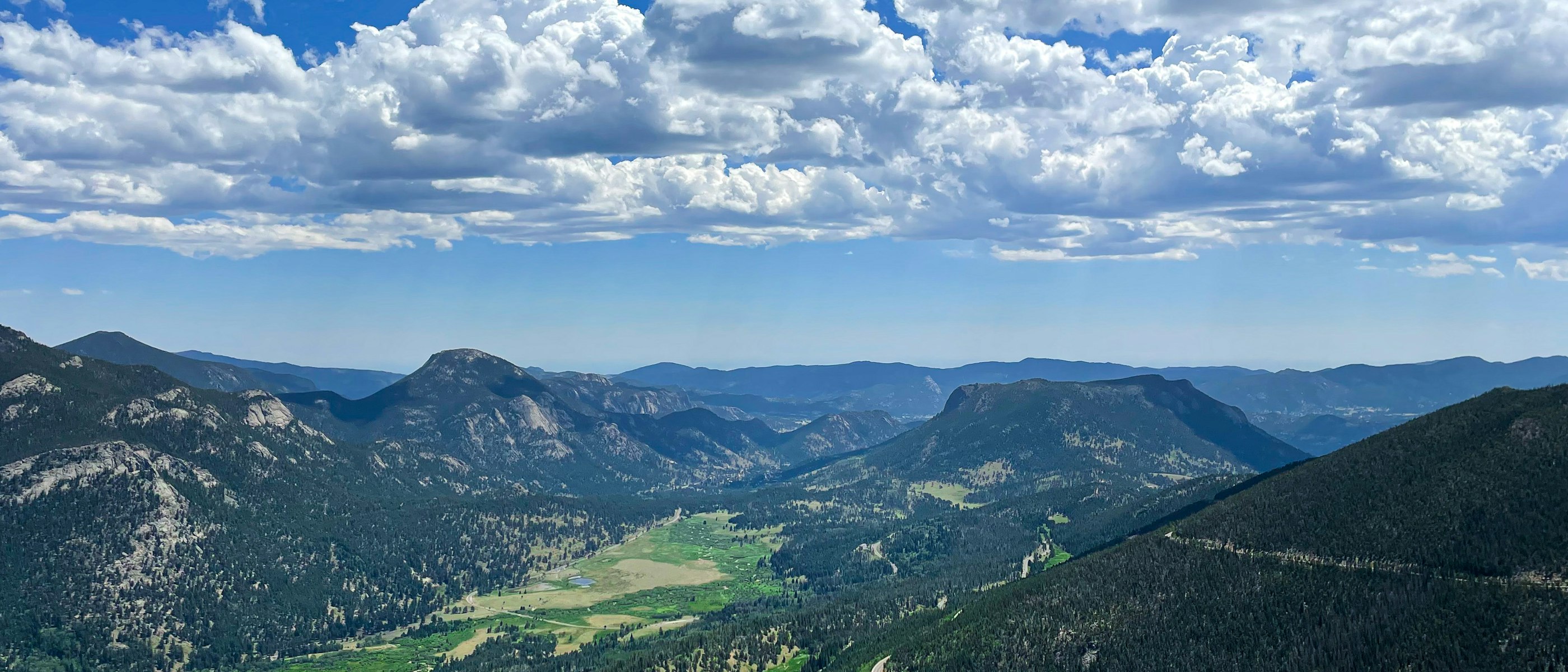 Layered ridgelines of the Colorado Front Range receding into cloud